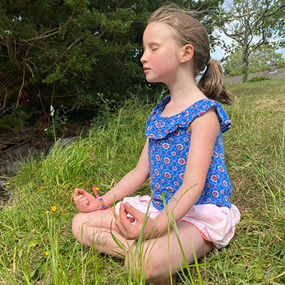 young girl meditating